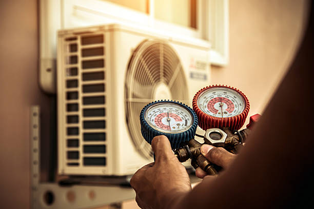 Professional Air Conditioning Service technician working in Gibson, AR